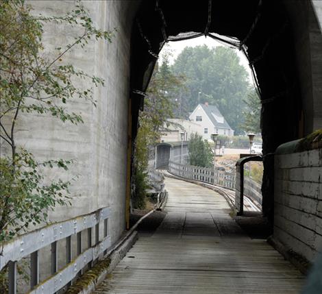 The road from the Kerr Dam winds south through a tunnel back to the dam’s housing complex