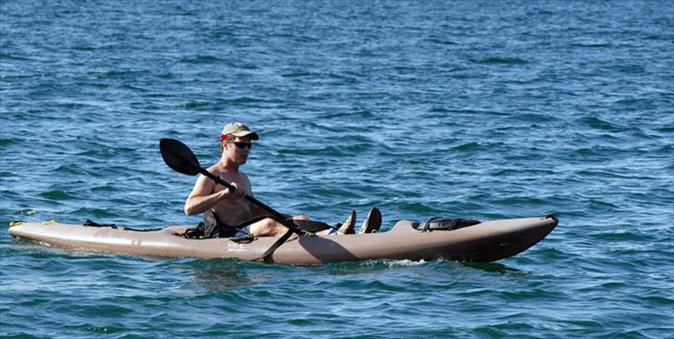 Sun and water add up to a good day for a kayaker near Big Arm.