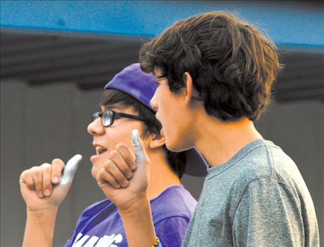 Korbyn Hernandez and Wacey McClure sing into their thumb “microphones” during the lip sync contest.