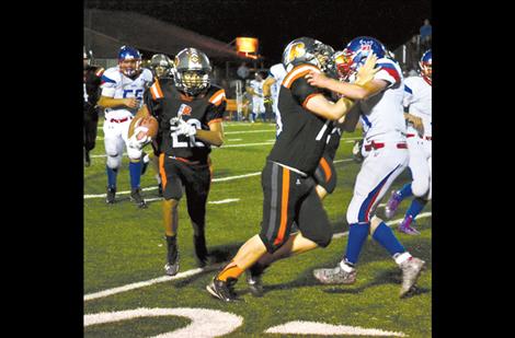 Ezekiel Misa looks for a hole during Ronan’s game against Bigfork on Friday.