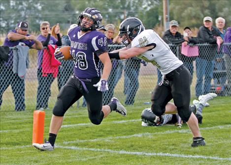 Charlo’s Jade Smith scores a touchdown off of a 19-yard run to open the Vikings’ game against Seeley-Swan Friday night. The Vikings won 54-16.