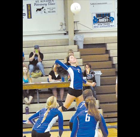 Mission senior Sydney Castor goes up for a swat Saturday at home.