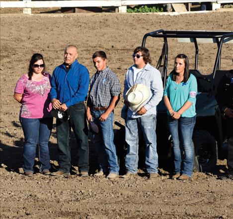 Terri and William Cleveland, left, join their children Nick, David and Monica in the arena. 