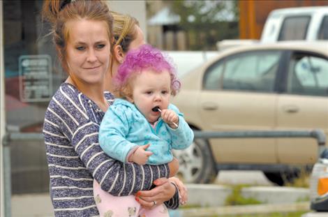 Maddie Herreid, eight-months, enjoys the parade.