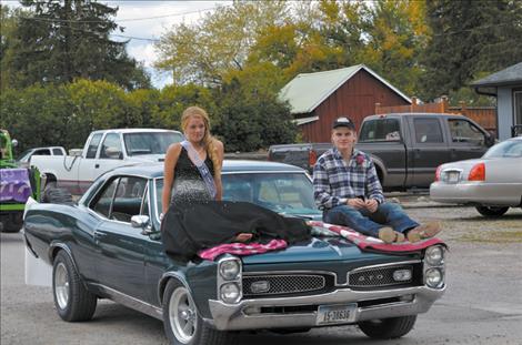 Juniors Devi Knutson and Blaine Bour ride in the parade.