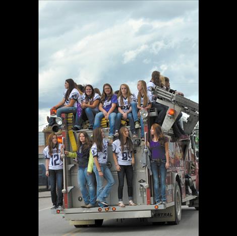 The fire department gives students a ride in the parade.