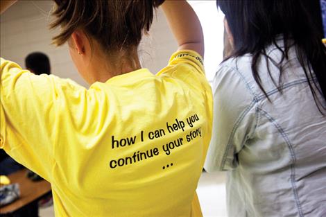 The back of the shirts encourage kids to talk about suicide.