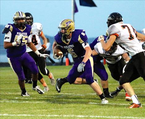 Matthew Rensvold breaks through Frenchtown defense with the help of his teammates keeping the Broncs at bay.