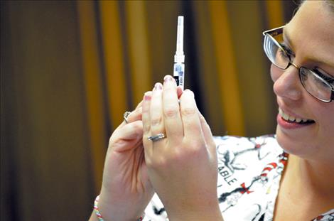 Traveling nurses administer flu shots