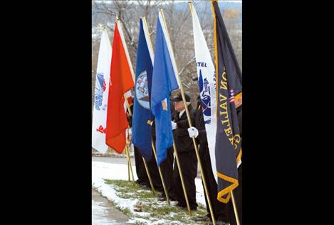 Mission Valley Honor Guard members hold flags representing every military branch during Sunday’s ceremony.