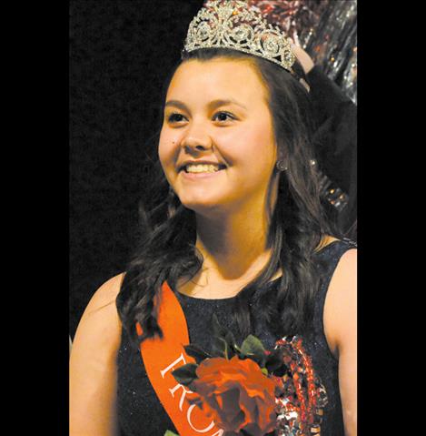 Morgan Malatare, right, is crowned queen.