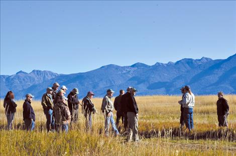 A group of folks talk about cooperative management styles in and around the Ninepipe National Wildlife Refuge.