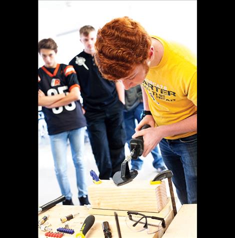 Student Jacob Dresden explores tools along the tour.