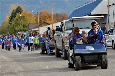 Students show their ‘Bulldog’ school  spirit as they circle town during the parade.