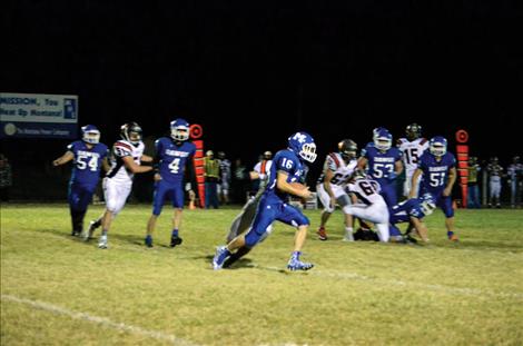 Mission Bulldog Mason Cates runs the ball during Friday’s 51-14 victory over the Ronan Chiefs.