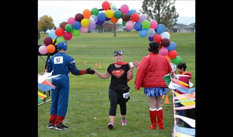 Superwoman” Shauna Wise completes the 5K event that benefits parks and outdoor activities