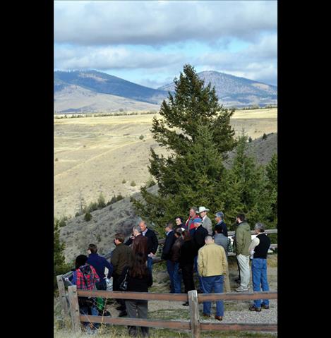 Energy Keepers, Inc. representatives show a group of elected officials and media members what it looks like above the dam. 