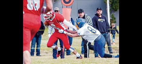 Arlee Warrior Tyler Tanner scores before snagging the game-ending interception with a one-handed grab.