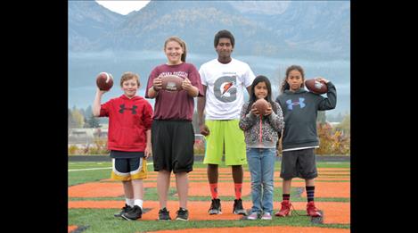 Ronan competitors, Elizabeth Bluemel, second from left and Kadynce Couture, furthest to the right, will join six other youths from Western Montana who have qualified to advance in the NFL Team Championship of the NFL Punt, Pass and Kick program. 