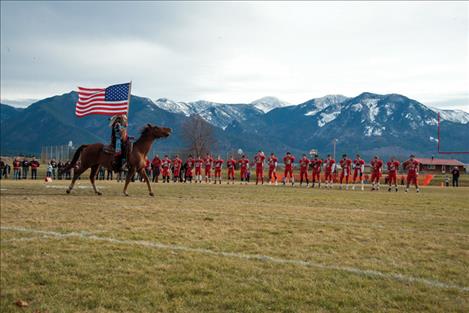 The Arlee Warriors begin each game with Louis Matt proudly parading the American flag.