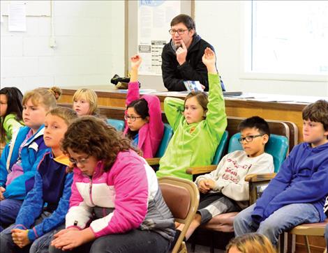 St. Ignatius students visit a mock town council meeting to ask questions about how their local government works.