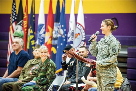 U.S. Army PFC Lindy Rutlege, a Polson graduate, addresses children at Linderman Elementary School Nov. 11.