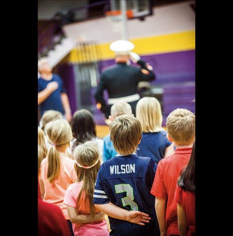 All eyes were on the American flag as it was raised in the gym.