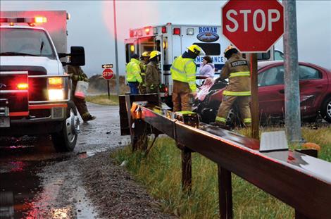 Emergency crews from Ronan and Polson respond to a Nov. 9 two-car fatal wreck near where Old Highway 93 crosses the southbound lanes of U.S. Highway 93 south of Pablo.