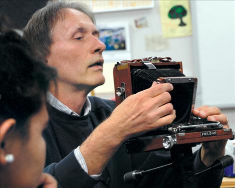 David Spear sets up a view camera for students to try during class at Two Eagle River School. 