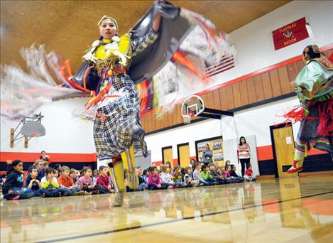 Ronan student Precious David demonstrates and teaches Native American dances Wednesday at K. William Harvey Elementary School.