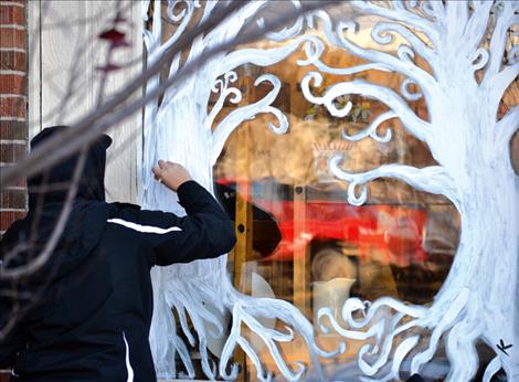 Twice But Nice thrift store is adorned with swirling snow-covered trees by Kianna Finley and Katlyn Santos.