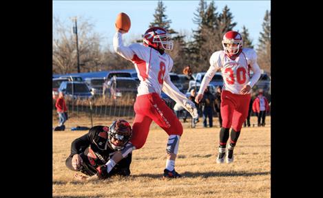 Tyler Tanner, left, and Colt Brazill battle through Saturday’s state championship game in Chinook