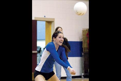 Mission Lady Bulldog Sara Nerby smiles in response to the announcer’s playful commentary during the Mission Valley all-star volleyball game Nov. 15 in St. Ignatius.