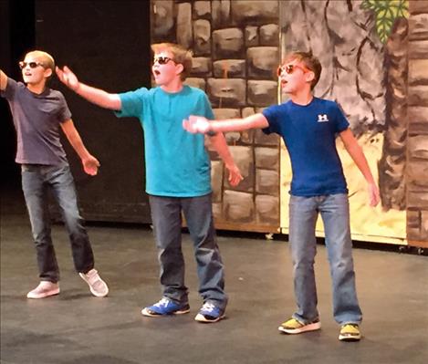 Caleb Cheff, Lathan Savage and Trenton Burland mouth the words to “Shut Up and Dance” as they perform their choreography.