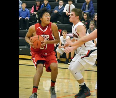 Two Eagle River’s Issaiah Mathias scored 18 points Friday and added  another 8 against Darby, right, on Saturday.