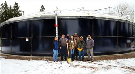 Celebrating the completion of Pablo and Lake County Water and Sewer District’s new water storage tank are Shari Johnson, district engineer for Shari A. Johnson and Associates Engineering; Mike Lee, district president; Christopher Stikes, operator; Leslie Arneson, office manger; Patrick Sorrell, district manager; Tim Courville, district board member; and Luke Taylor, operator.