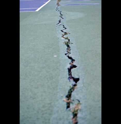 The school’s  tennis  court is  cracking.