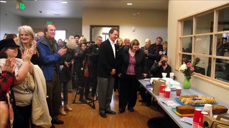 Governor Steve Bullock celebrates the completion of the Lake House with community members.