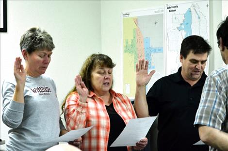 Julie Lynn Moore, Ellen Kaphammer and Cal Hardy take their seats on the Ronan City Council in January. 