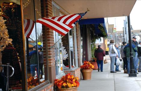 Shoppers patronize local stores along Polson’s Main Street on Small Business Saturday.