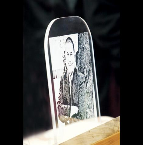 An etching of Robert DePoe III, the third president of Salish Kootenai College, was on display at his funeral service Monday in the Joe McDonald Fitness Center Gym.