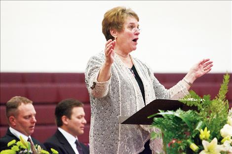 Tillie Marshall leads singing at the service.