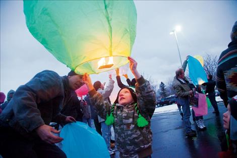 Many people gathered at the Community Lantern Lighting in Polson Dec. 31, sending wishes and light into the sky to welcome in the new year. 