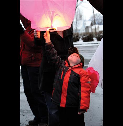 Aiden Takacs, 5, gets ready to let go of his lantern.