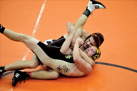Ronan Chief Kail Cheff pins Stevensville’s Mason Griffin in 3 minutes during round one of the 182-pound weight class.
