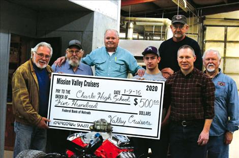 The Mission Valley Cruisers donate $500 to Charlo High School’s automotive class. From left are Richard Santorno, Mike Lee,  John Moon,  Toby Odom,  Tim Arneson,  Stan Atchley, and Jack Bishop.