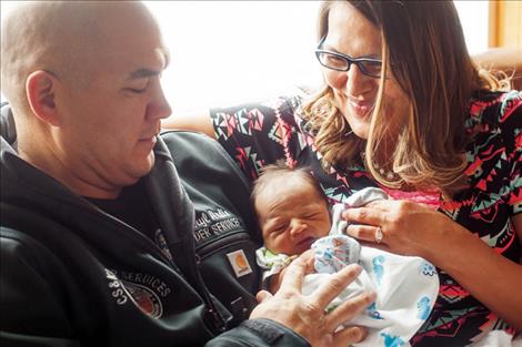 Ford Monroe Ardis poses with his parents after being the first 2016 baby born in Lake County.