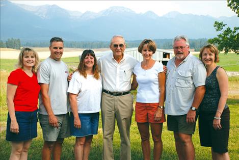 Members of the Theiler family gather in 2007 to honor Polson High School math teacher John Oberlitner. Pictured from left are Sarah Theiler Horten, Albuquerque, New Mexico; Hugh Theiler, Wenatchee, Washington; Betsy Theiler, Craswell, Puyallup, Washington; John Oberlitner; Kathleen Theiler Elliott, Eagle, Idaho; Matthew Theiler, Idaho Falls, Idaho; and MaryPat Theiler Cheng; Seattle, Washington.