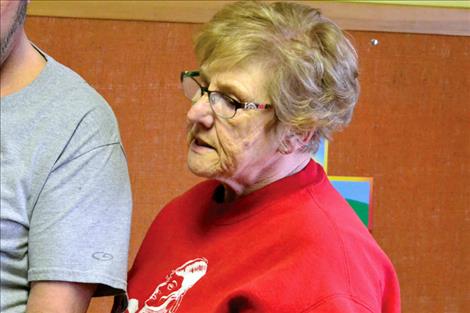 Sharon Stevens,  a volunteer at the Food Pantry,  enjoys visiting with  people as she helps them select food items. 