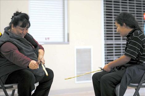 Sarah and Mars Sandoval enjoy some quality time while carving double-ball sticks